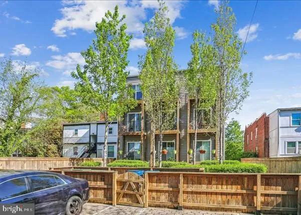 front view of a building with a garden
