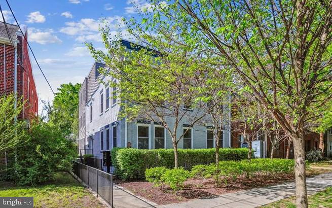 1340 Nicholson Street Northwest, Unit 2 Washington, DC 20011 - Photo 16 of 16 a view of a brick building next to a yard