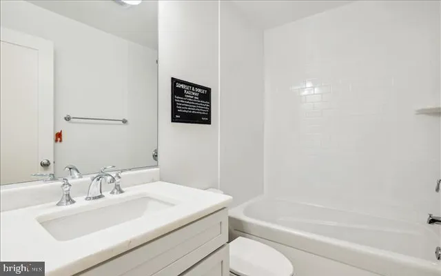 a bathroom with a sink toilet and bathtub