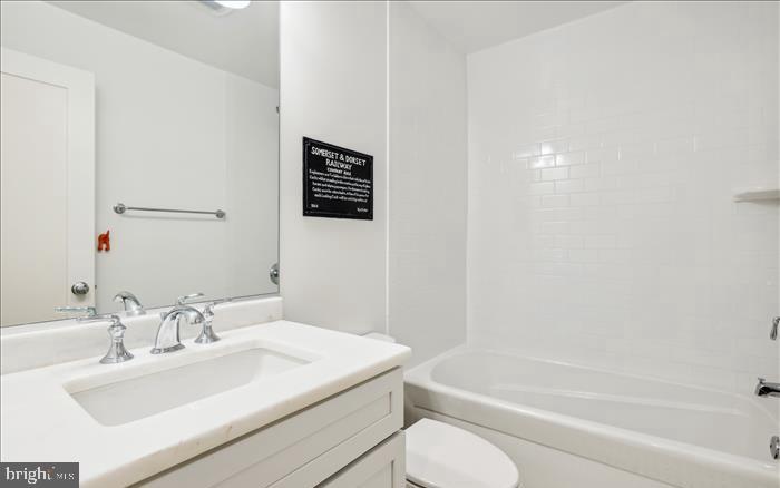 1340 Nicholson Street Northwest, Unit 2 Washington, DC 20011 - Photo 9 of 16 a bathroom with a sink toilet and bathtub