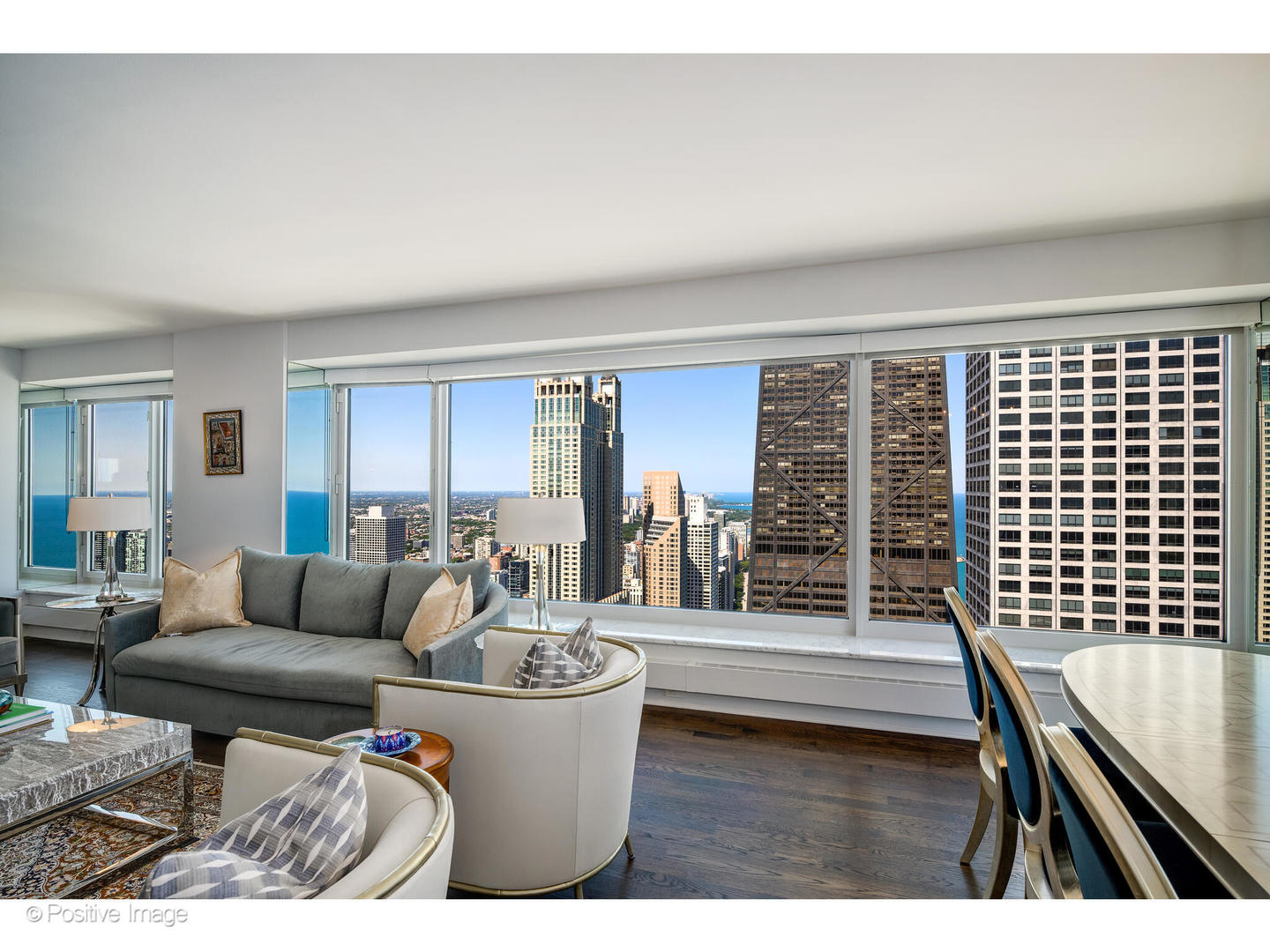 161 East Chicago Avenue, Unit 54A Chicago, IL 60611 - Photo 11 of 41 a living room with furniture a rug and a floor to ceiling window