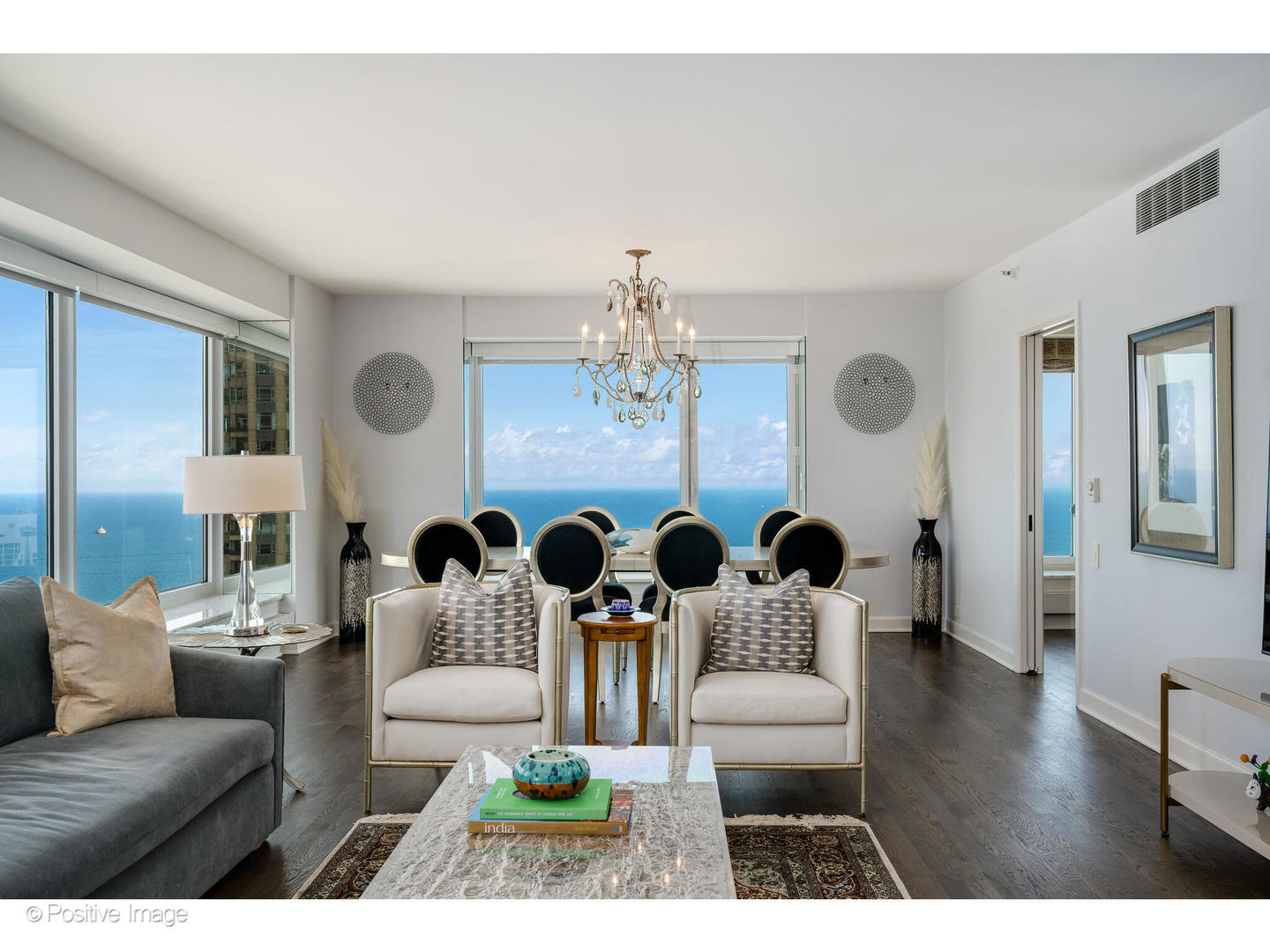 161 East Chicago Avenue, Unit 54A Chicago, IL 60611 - Photo 15 of 41 a living room with furniture and a chandelier