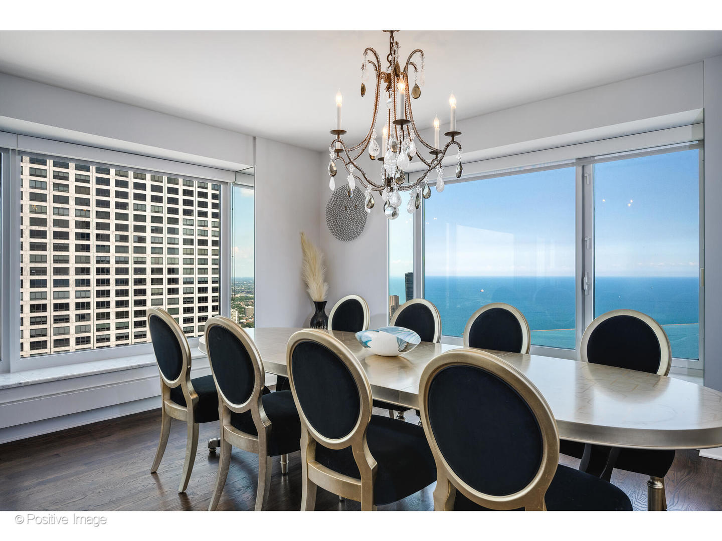 161 East Chicago Avenue, Unit 54A Chicago, IL 60611 - Photo 16 of 41 a view of a dining room with furniture and chandelier