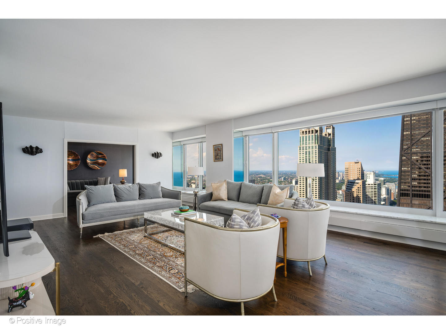 161 East Chicago Avenue, Unit 54A Chicago, IL 60611 - Photo 17 of 41 a living room with furniture and wooden floor