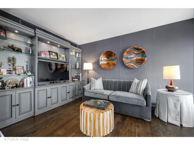 a living room with furniture and flat screen tv