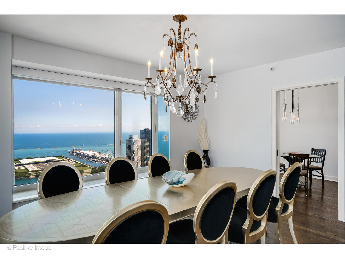 161 East Chicago Avenue, Unit 54A Chicago, IL 60611 - Photo 23 of 41 a view of a dining room with furniture and chandelier