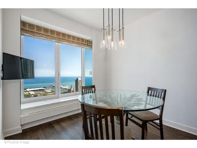 a outdoor dining room with furniture and window