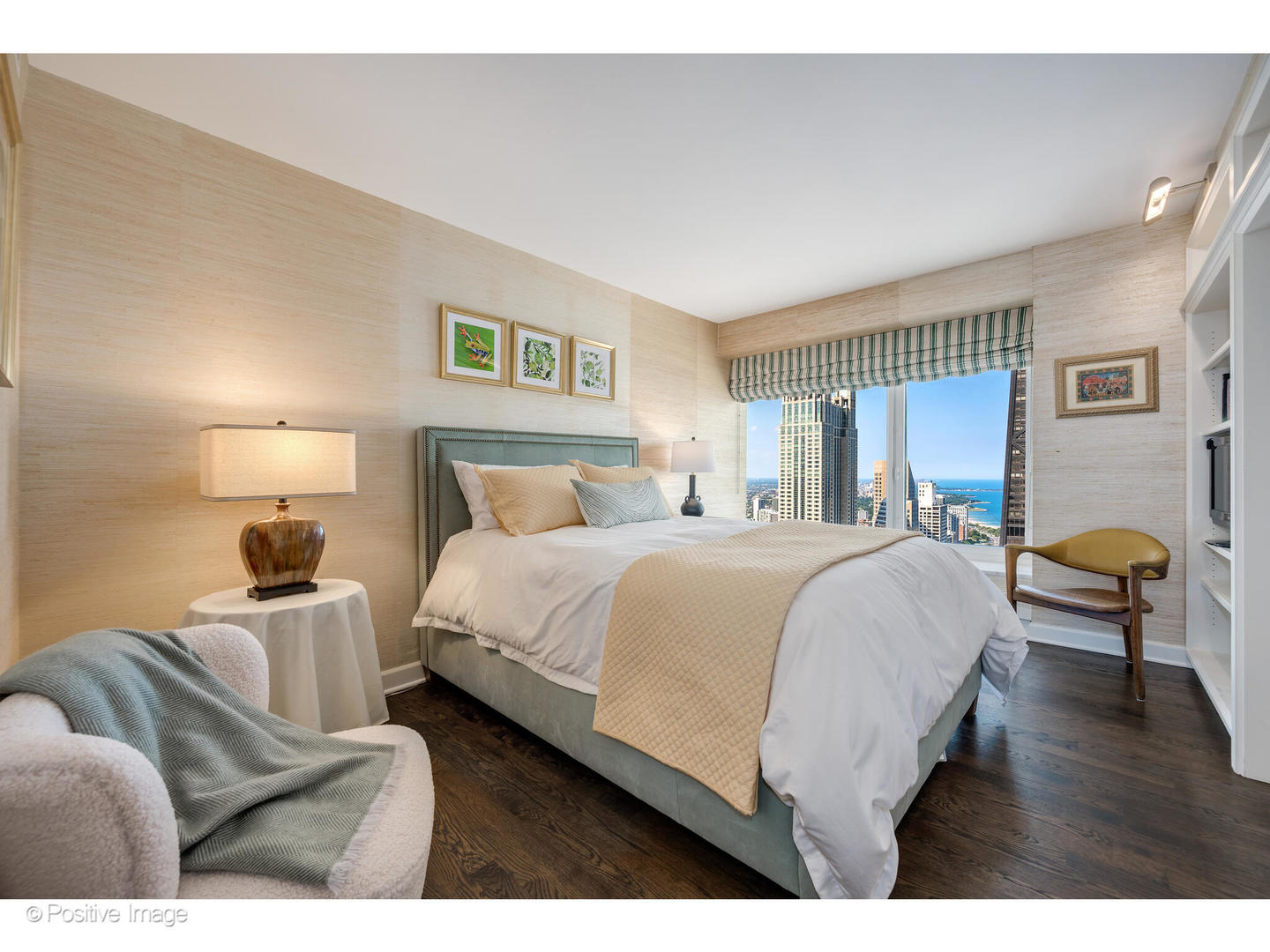 161 East Chicago Avenue, Unit 54A Chicago, IL 60611 - Photo 30 of 41 a bedroom with a bed and wooden floor