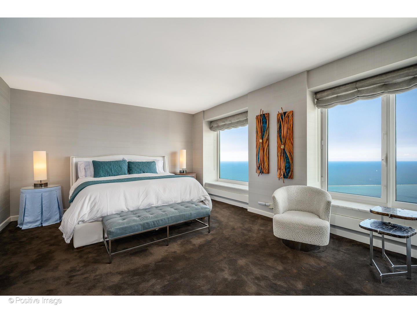 161 East Chicago Avenue, Unit 54A Chicago, IL 60611 - Photo 35 of 41 a spacious bedroom with a bed and a large window