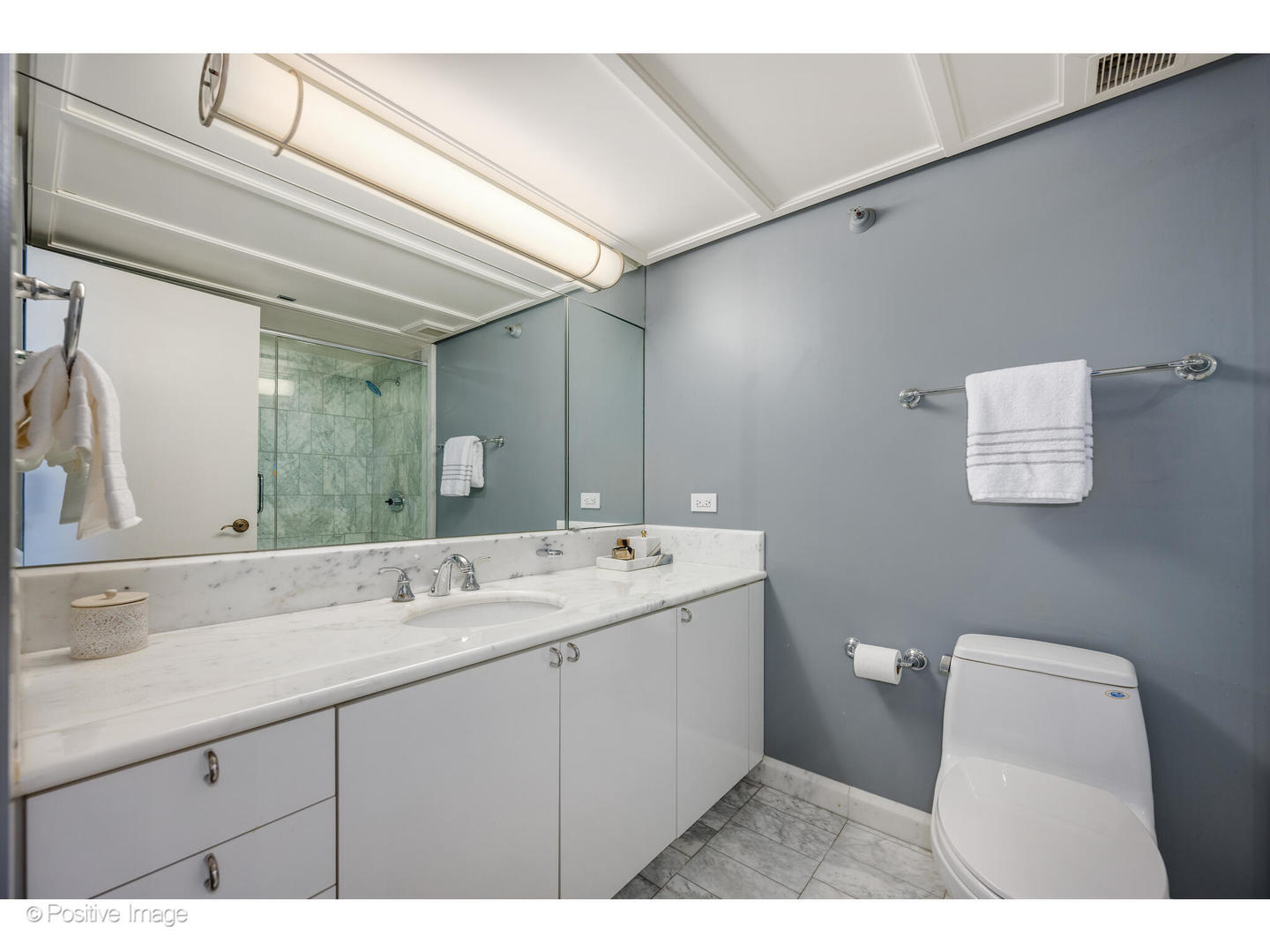 161 East Chicago Avenue, Unit 54A Chicago, IL 60611 - Photo 36 of 41 a bathroom with a sink a toilet and mirror