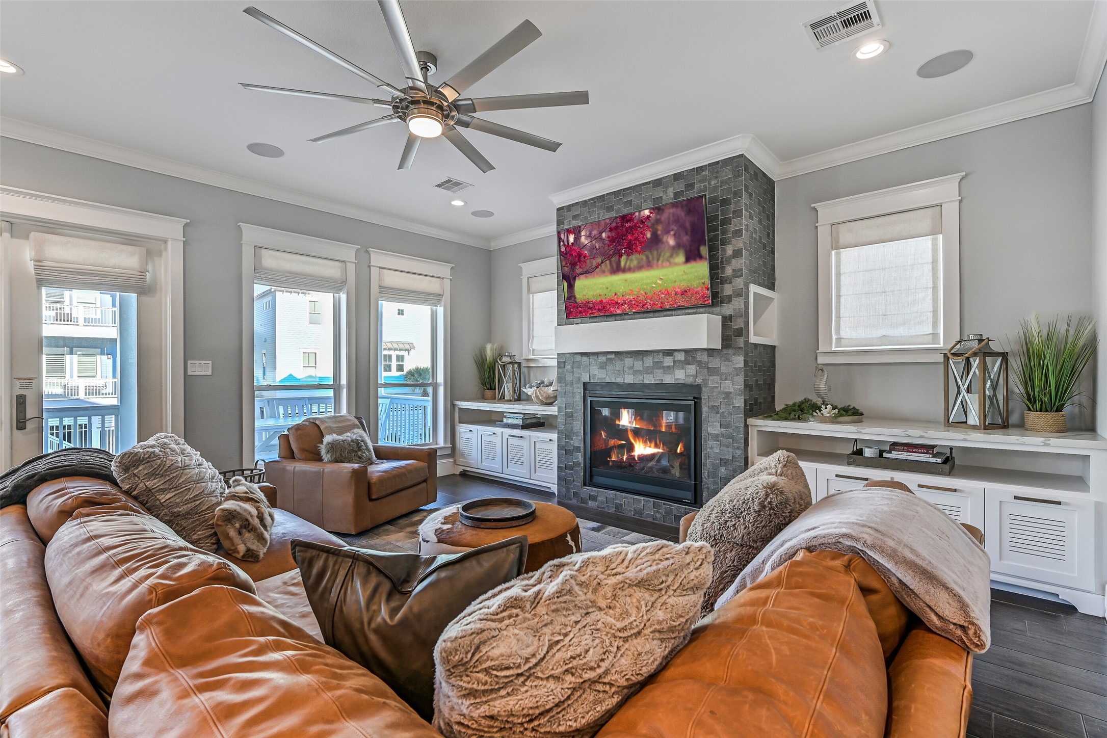3839 Periwinkle Galveston, TX 77554 - Photo 14 of 49 A wall of windows provide an abundance of natural light throughout the space.