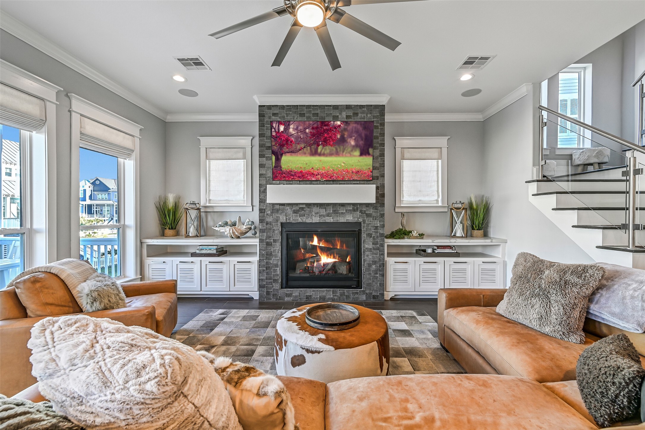 3839 Periwinkle Galveston, TX 77554 - Photo 15 of 49 Built-in storage beneath the windows on both sides of the gas fireplace.