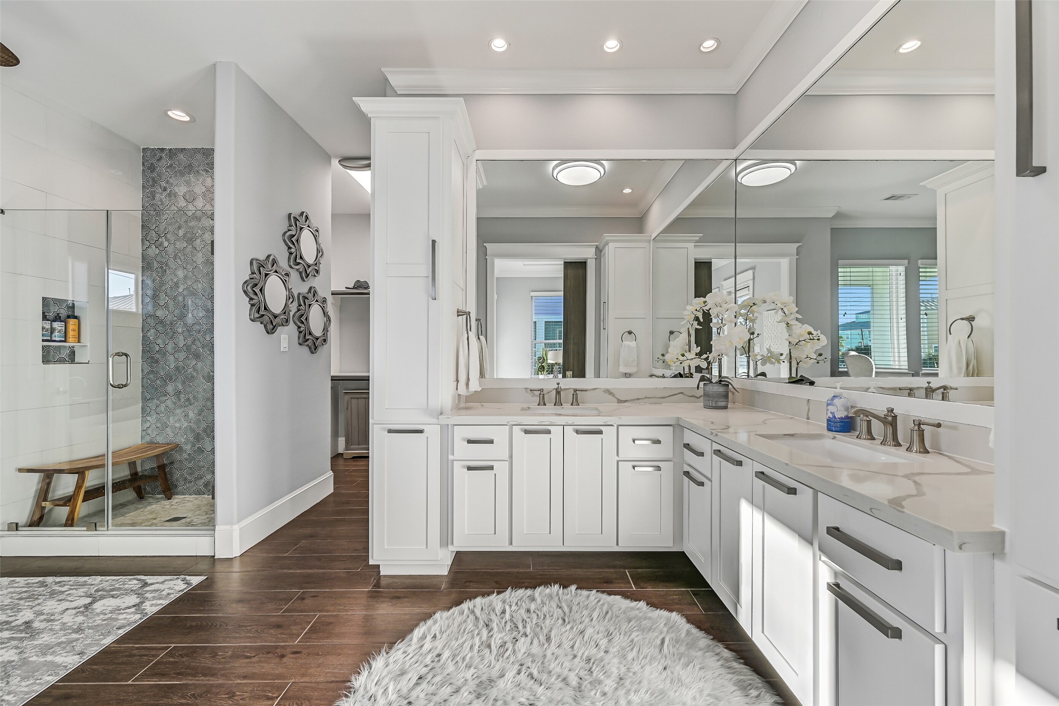 3839 Periwinkle Galveston, TX 77554 - Photo 22 of 49 Boasting generous cabinetry, double sinks, soaking tub, and a spacious walk-in shower, this bathroom combines style and functionality.