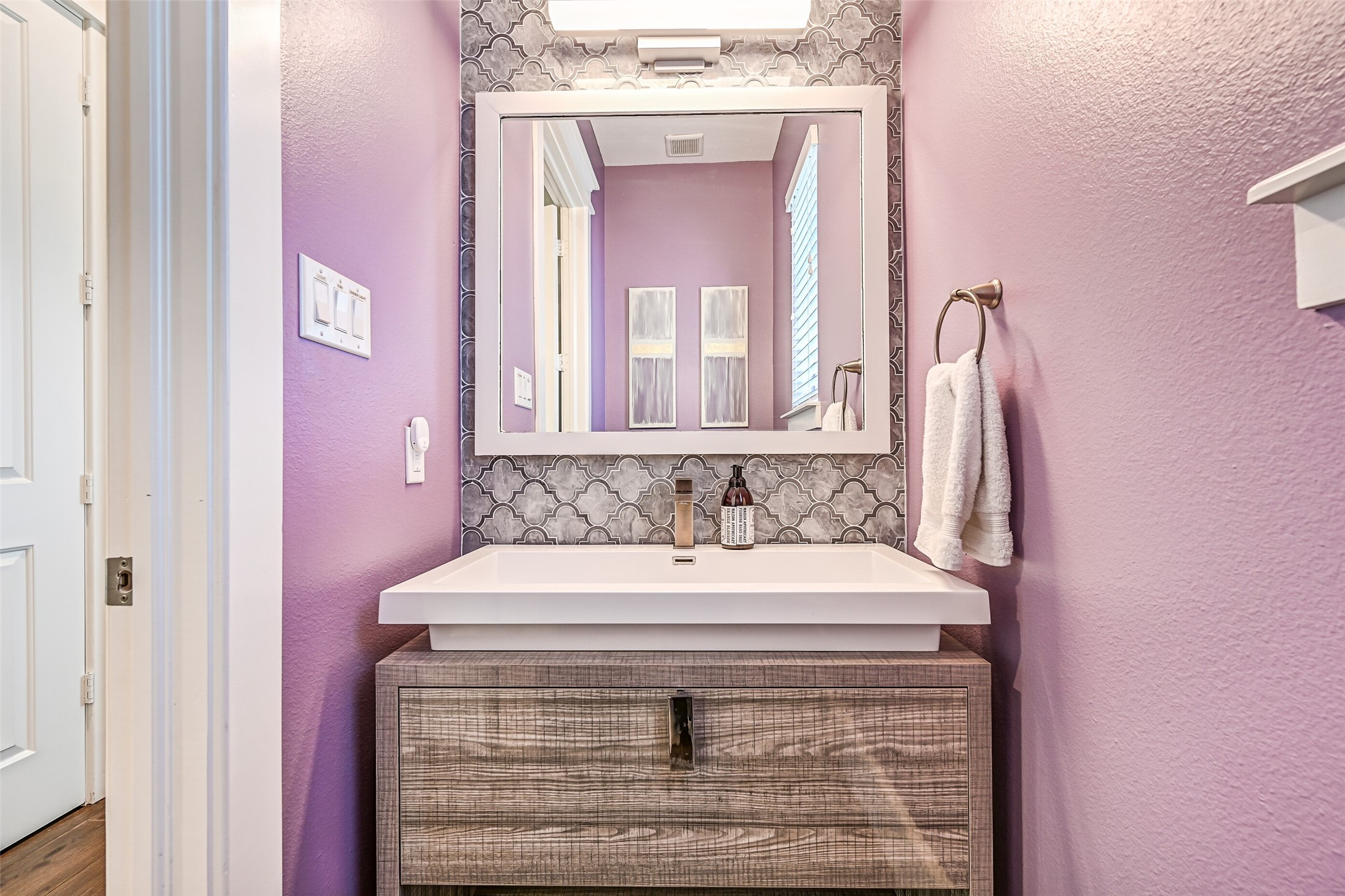 3839 Periwinkle Galveston, TX 77554 - Photo 29 of 49 The half bath located off of the kitchen.