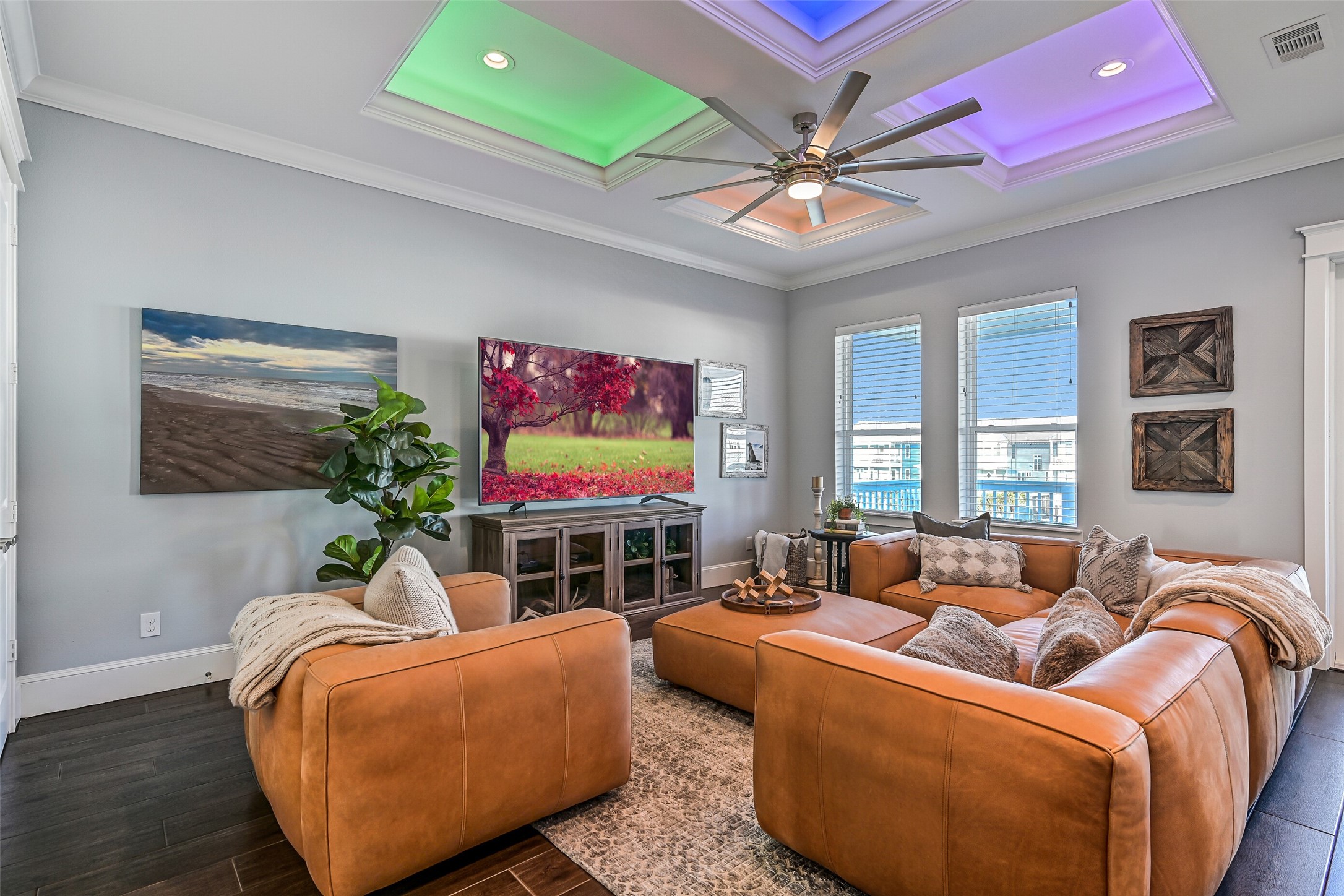 3839 Periwinkle Galveston, TX 77554 - Photo 30 of 49 As you walk or take the elevator upstairs you will find this expansive family room that offers the perfect space for cozy movie nights, lively game nights, or entertaining guests with ease and style.