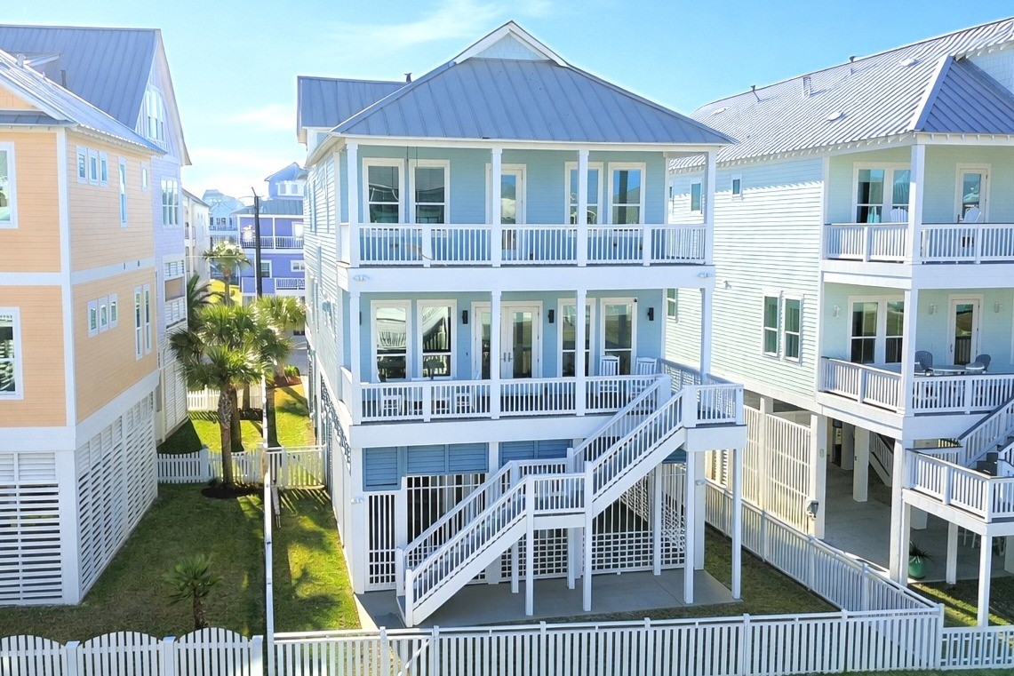 3839 Periwinkle Galveston, TX 77554 - Photo 3 of 49 Rear view of the home with gate to easily access the dune crossover.