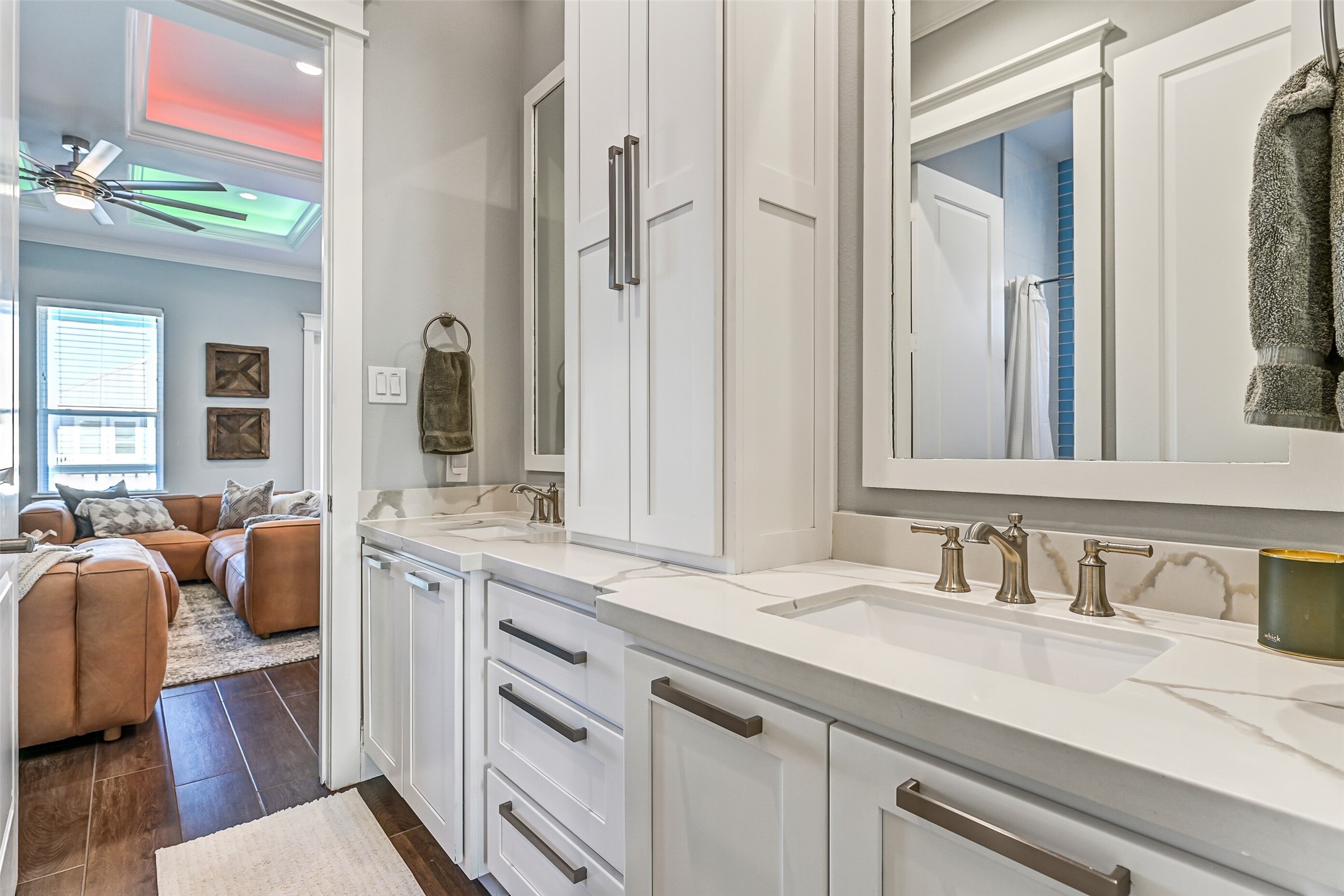 3839 Periwinkle Galveston, TX 77554 - Photo 39 of 49 The bathroom connects has acces from both the family room and bunk room. This bathroom offers lots of cabinets, double sinks and a tub/shower combo