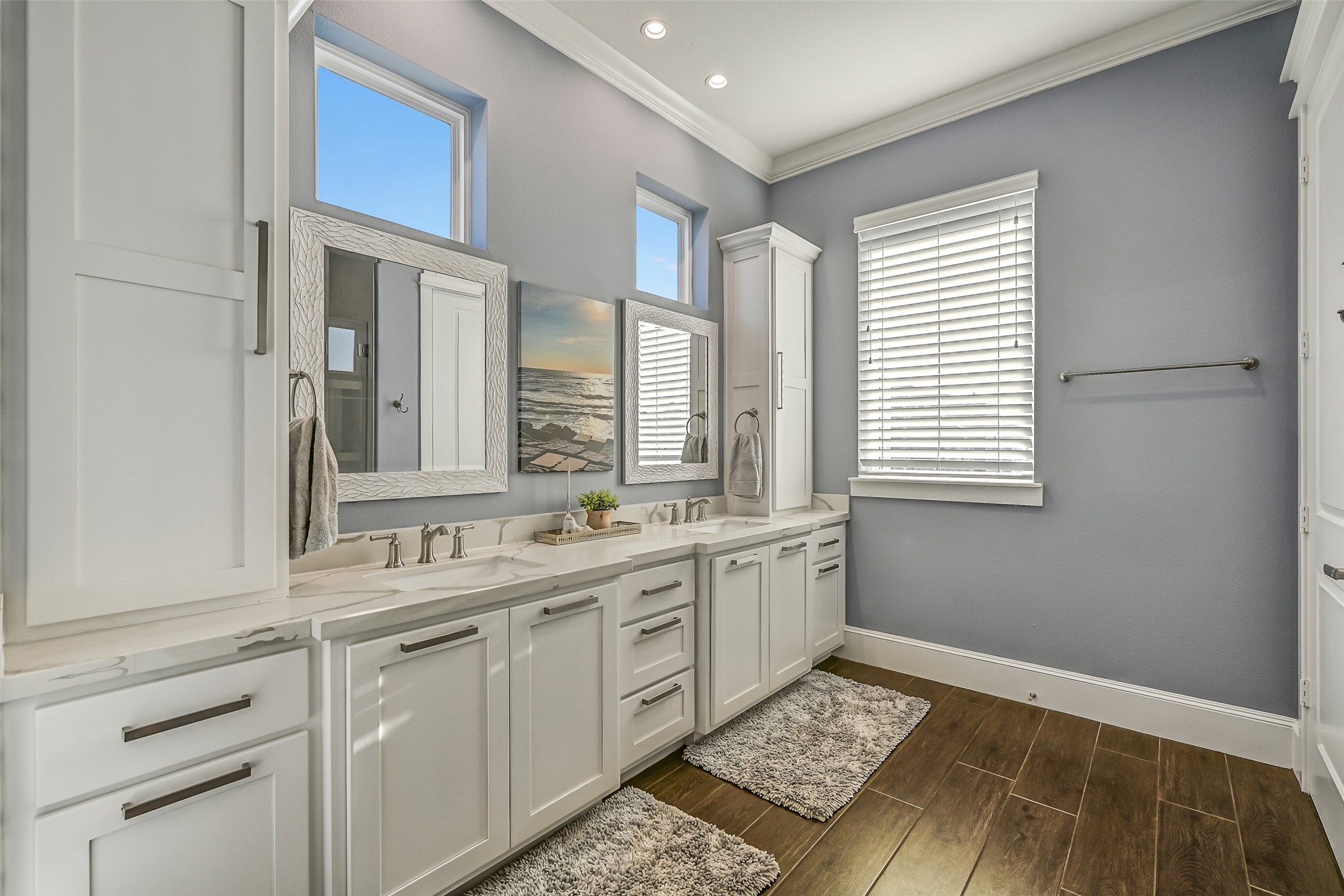 3839 Periwinkle Galveston, TX 77554 - Photo 43 of 49 The junior suite bathroom features double sinks and a spacious shower.