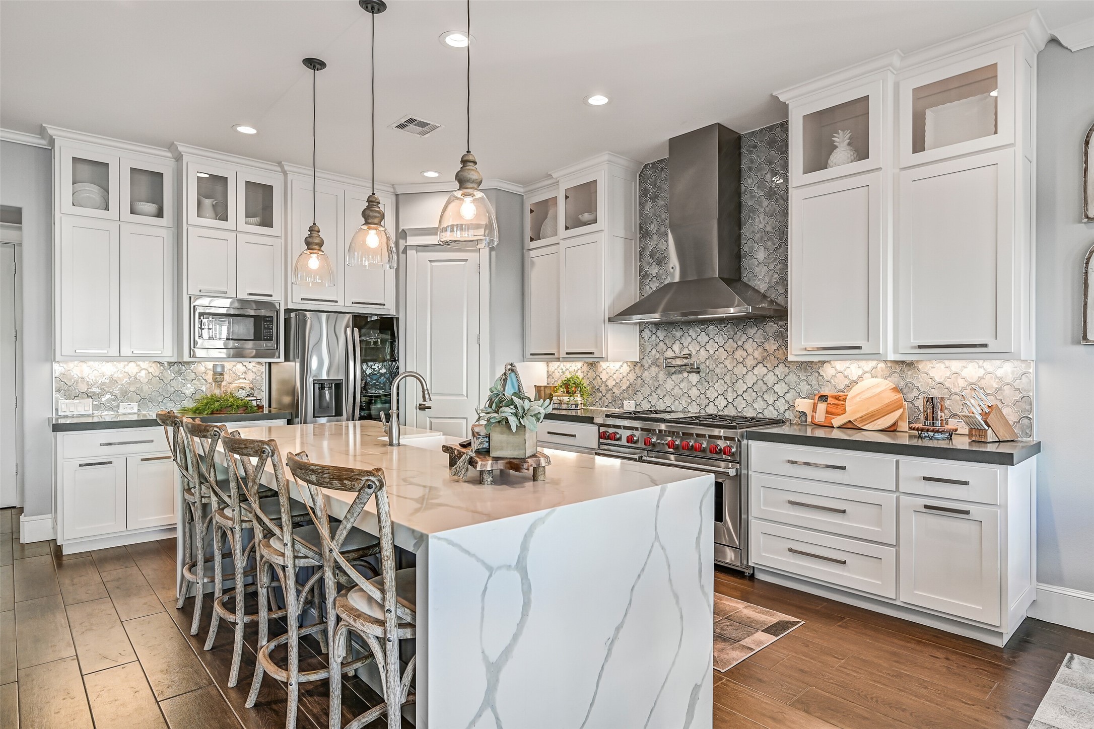 3839 Periwinkle Galveston, TX 77554 - Photo 8 of 49 The space is enhanced by ample cabinetry and a stunning backsplash.