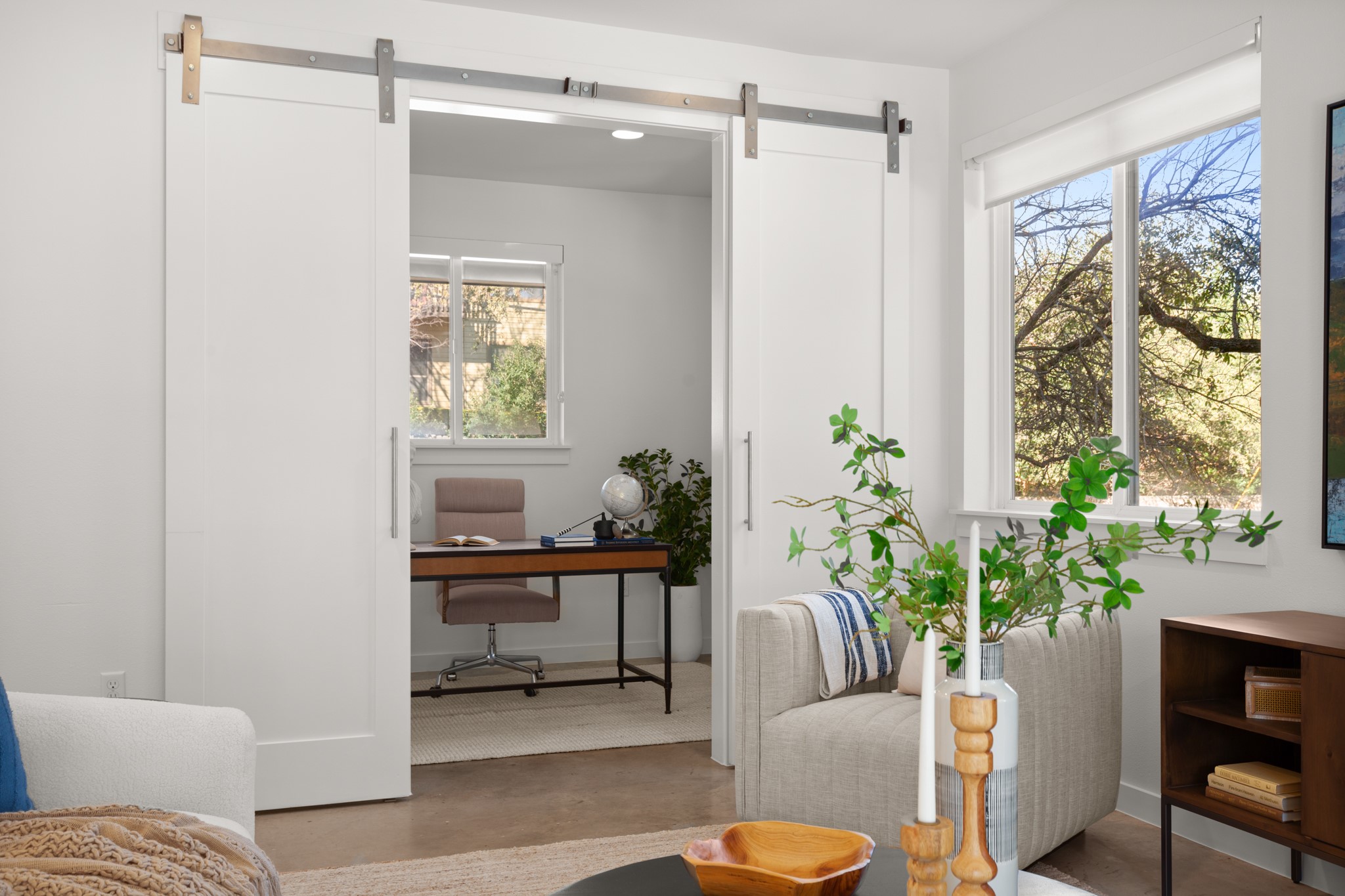 4111 Spicewood Springs Road, Unit 1 Austin, TX 78759 - Photo 5 of 31 Barn doors lead to a flex room that can be used as an office space, workout room, or art studio