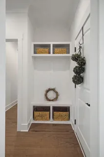a view of an entryway with wooden floor