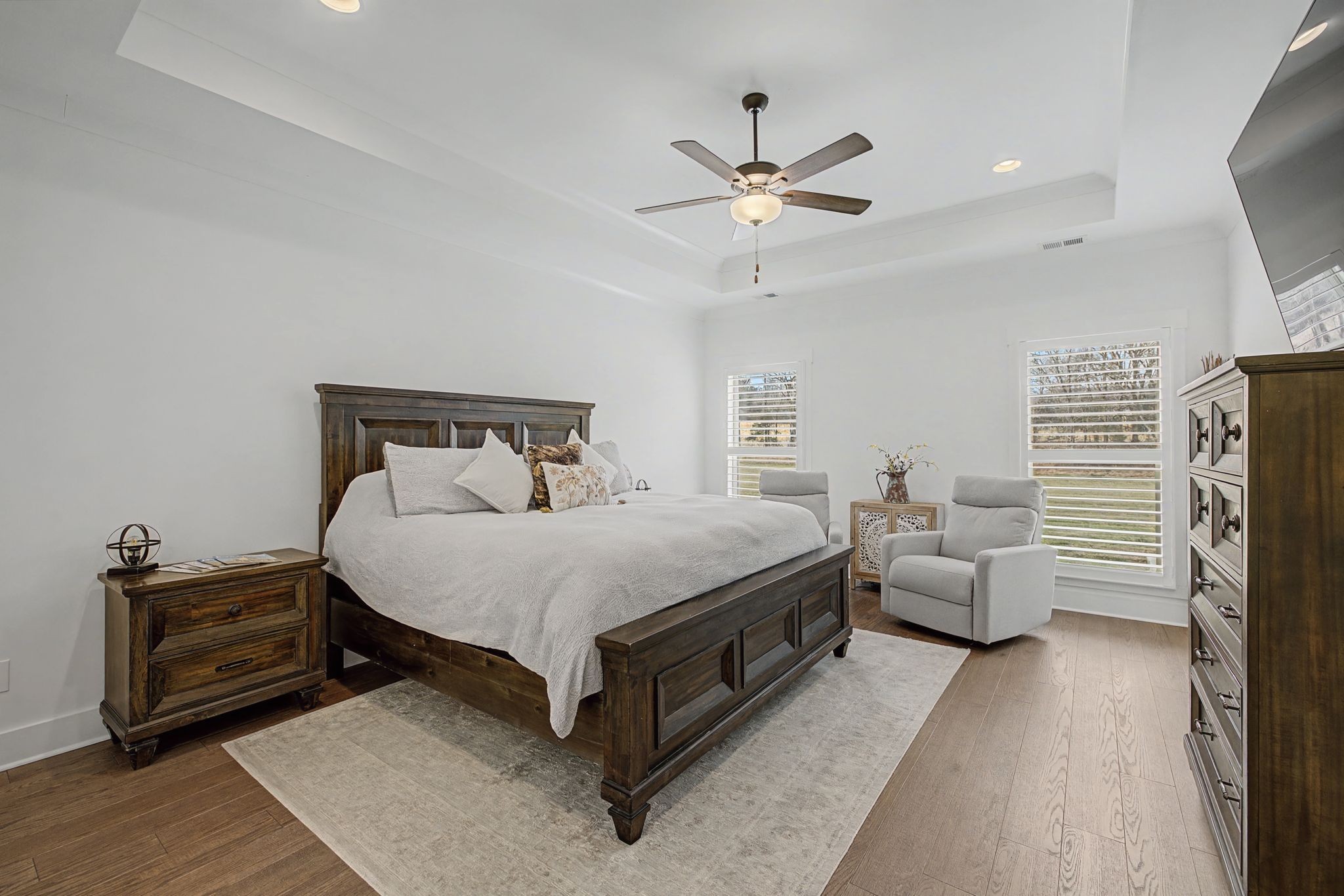 238 Hill Creek Road Woodbury, TN 37190 - Photo 16 of 40 a spacious bedroom with a bed and a chandelier