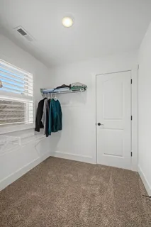 a bathroom with a double vanity sink toilet and shower