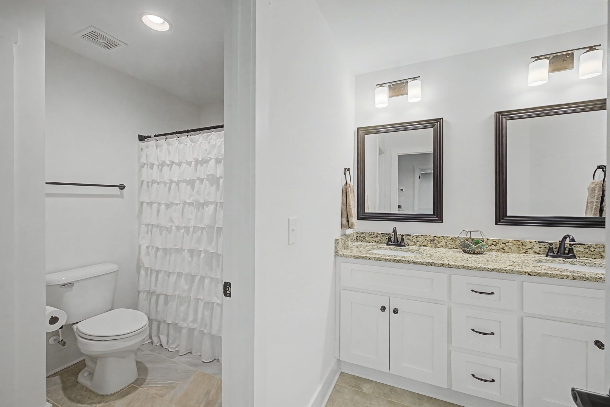 238 Hill Creek Road Woodbury, TN 37190 - Photo 30 of 40 a bathroom with a double vanity sink toilet and shower