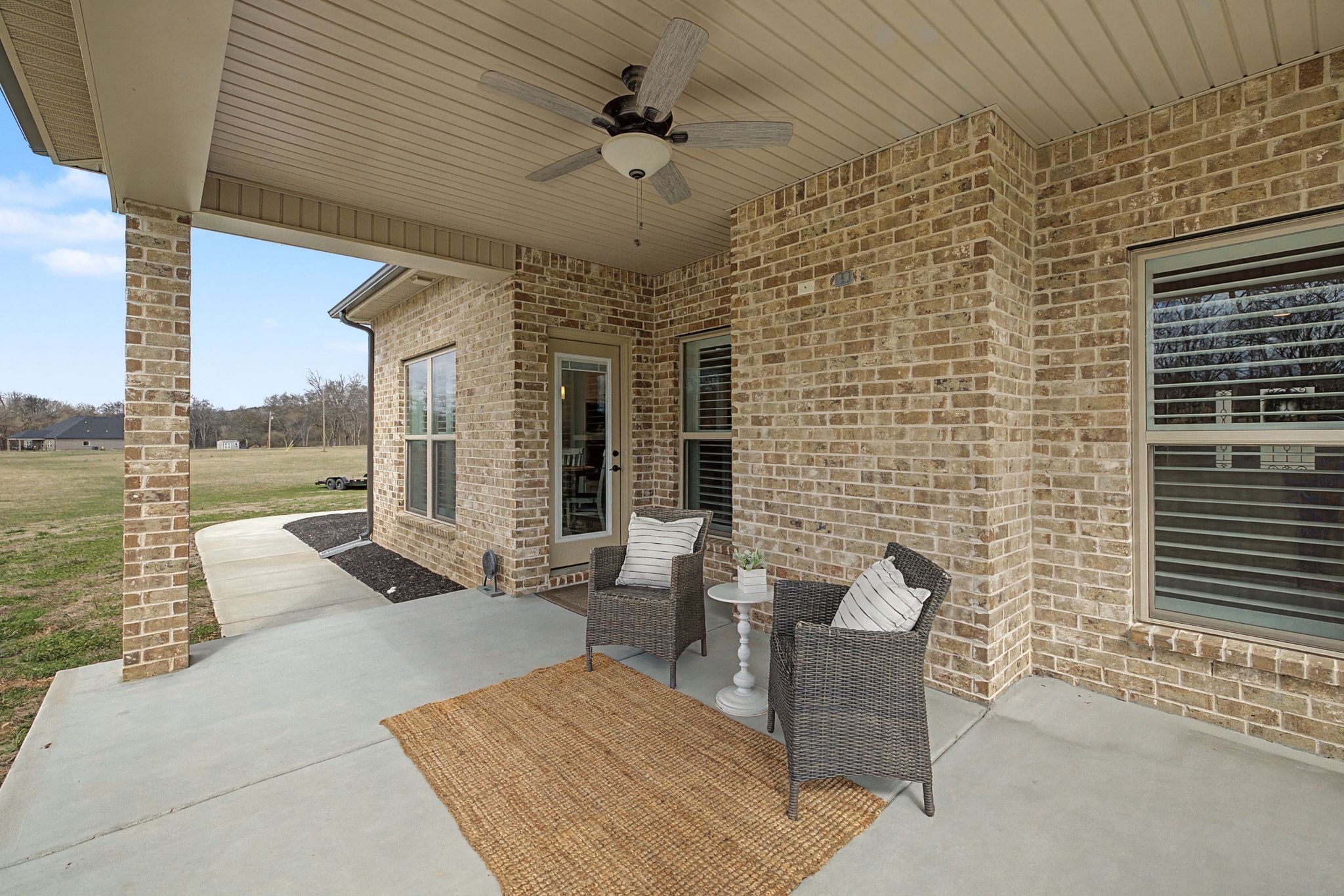 238 Hill Creek Road Woodbury, TN 37190 - Photo 35 of 40 a view of a patio with a table and chairs