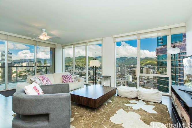 a living room with furniture and a large window