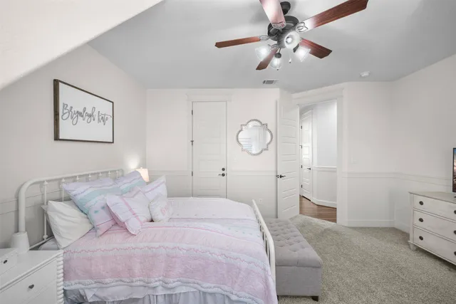 a bathroom with a granite countertop sink a mirror and shower