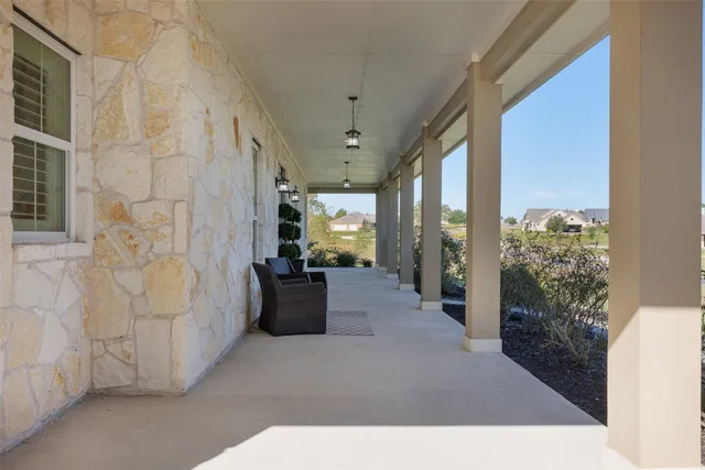 an aerial view of a house with a yard basket ball court