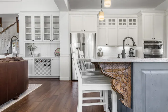 a view of a kitchen with furniture and entryway