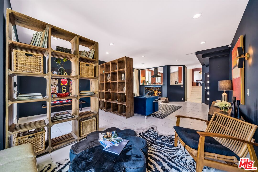 679 Washington Boulevard Marina del Rey, CA 90292 - Photo 8 of 37 a living room with furniture a rug and a window