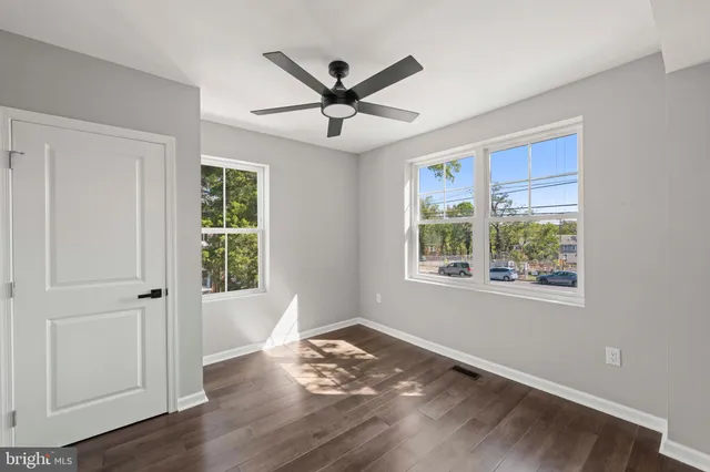 a bathroom with a sink a bathtub and next to a window