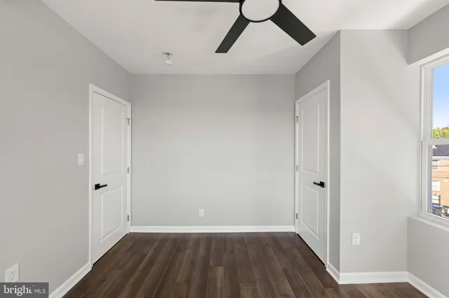 a bathroom with a toilet a sink and a mirror