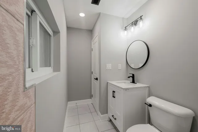 a front view of a house with a garden and deck