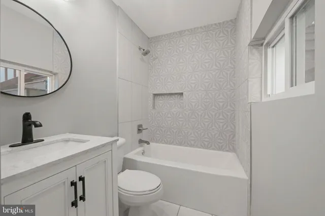 a view of a hallway with wooden floor and glass door