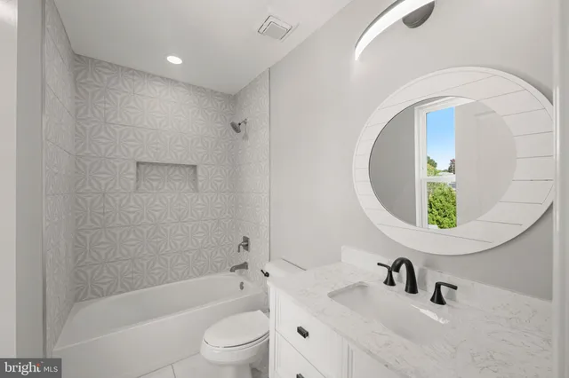 a view of a workspace room with furniture and wooden floor