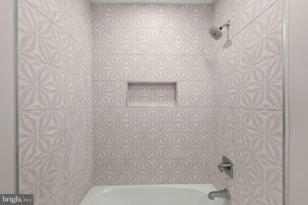 a living room with furniture a rug and a window