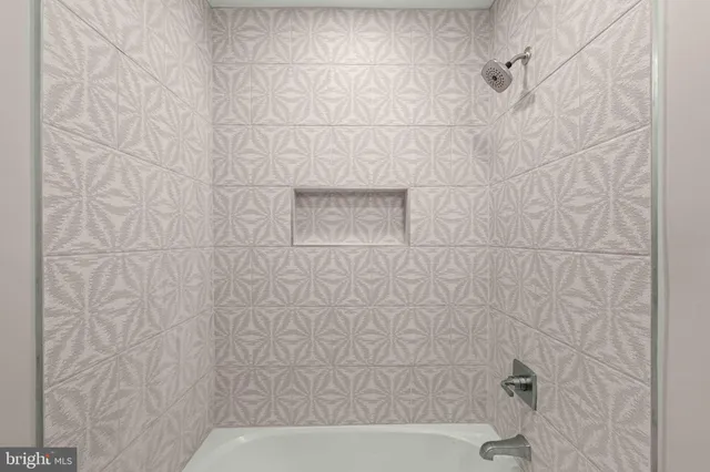 a living room with furniture a rug and a window