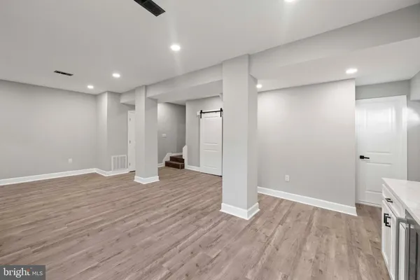 a bathroom with a shower and a sink