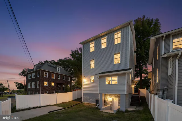 a bathroom with a toilet and a mirror