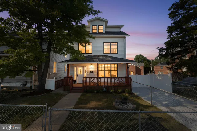 a bathroom with a shower a sink and a mirror