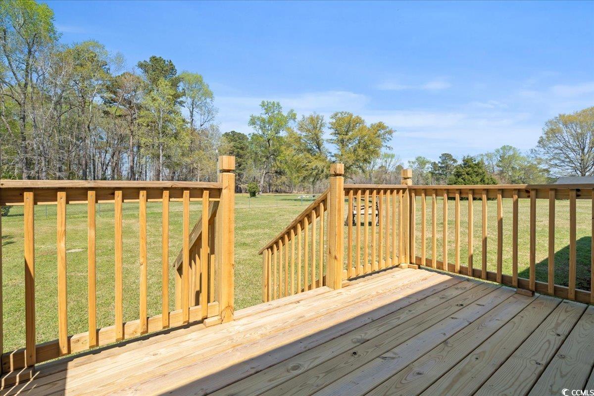 1130 Buck Swamp Road Fork, SC 29543 - Photo 24 of 35 Wooden deck with a yard