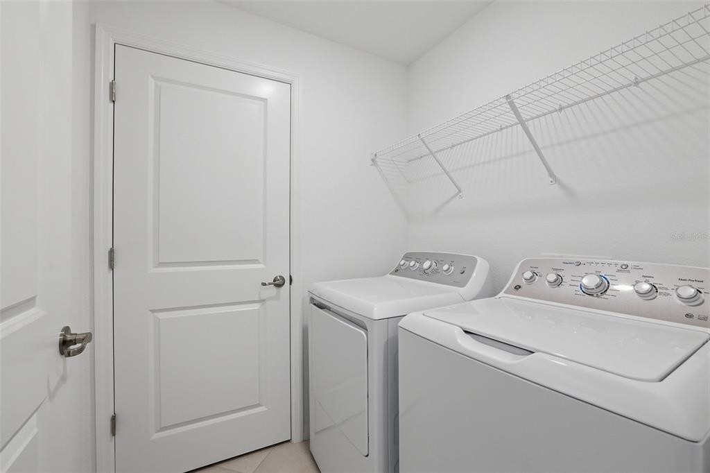 19227 Cherrystone Way, Unit 101 Lakewood Ranch, FL 34211 - Photo 16 of 19 a utility room with dryer and washer