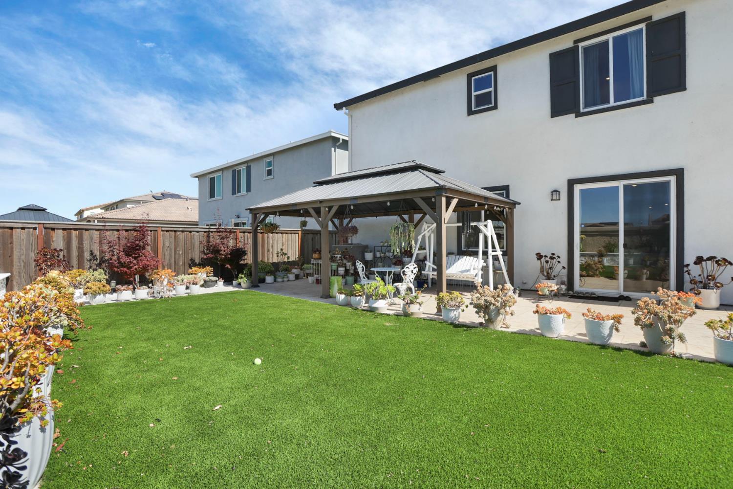 6949 Foraker Drive Stockton, CA 95219 - Photo 3 of 34 a view of a house with backyard garden and porch