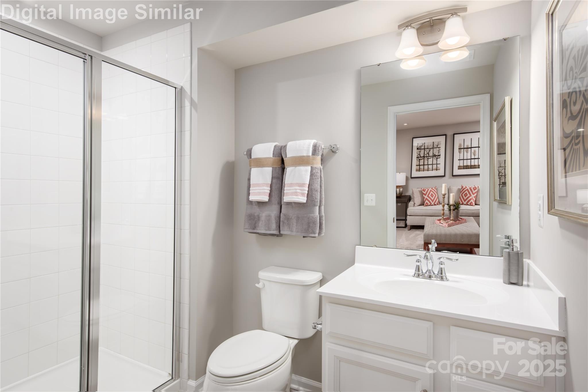 6334 Durango Way Denver, NC 28037 - Photo 14 of 22 a bathroom with a sink toilet and mirror