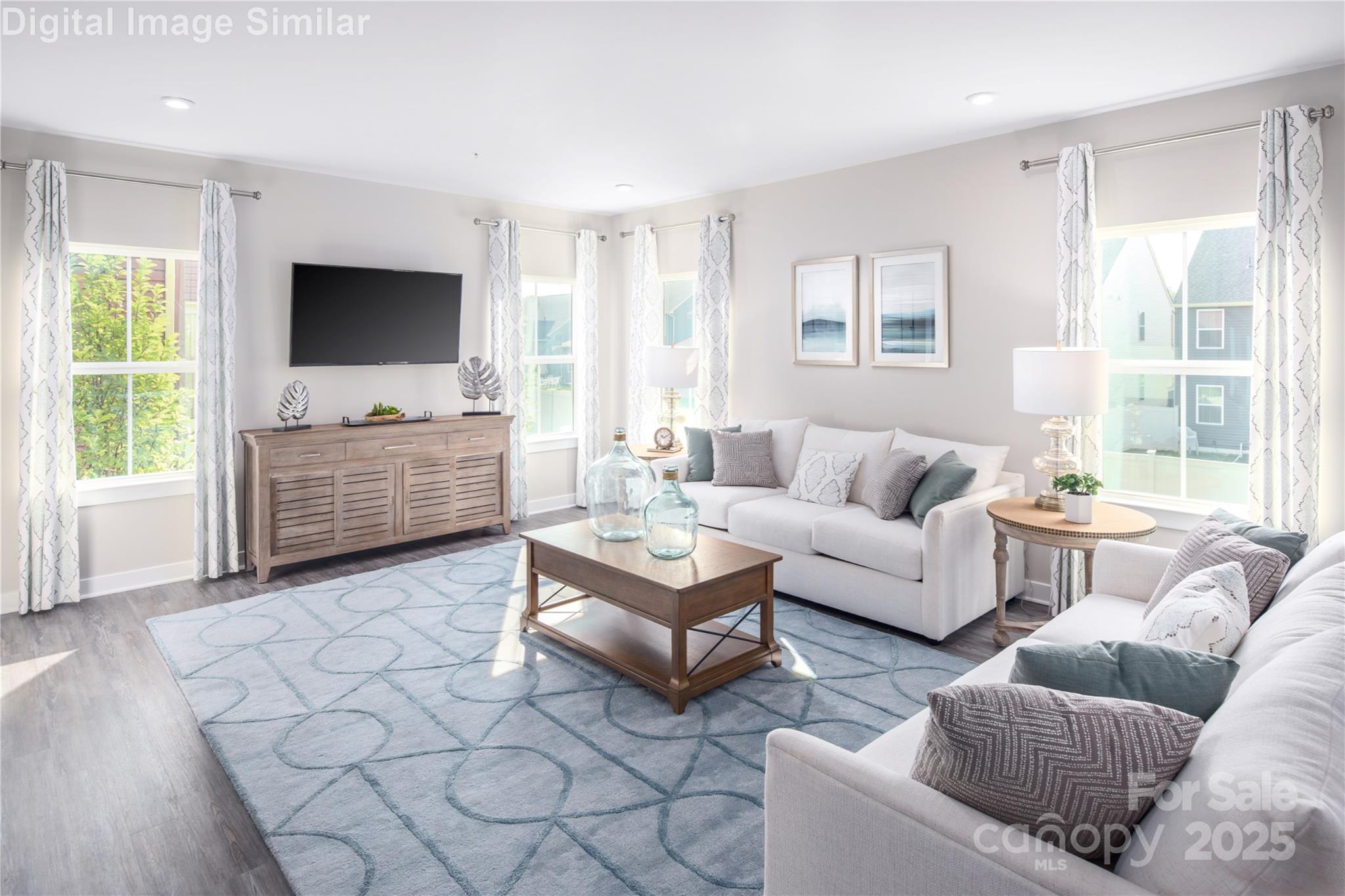 6334 Durango Way Denver, NC 28037 - Photo 4 of 22 a living room with furniture and a flat screen tv