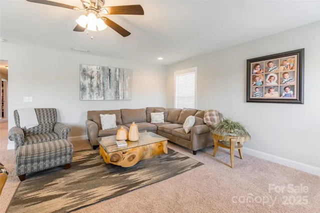 a bedroom with a bed dresser and a window